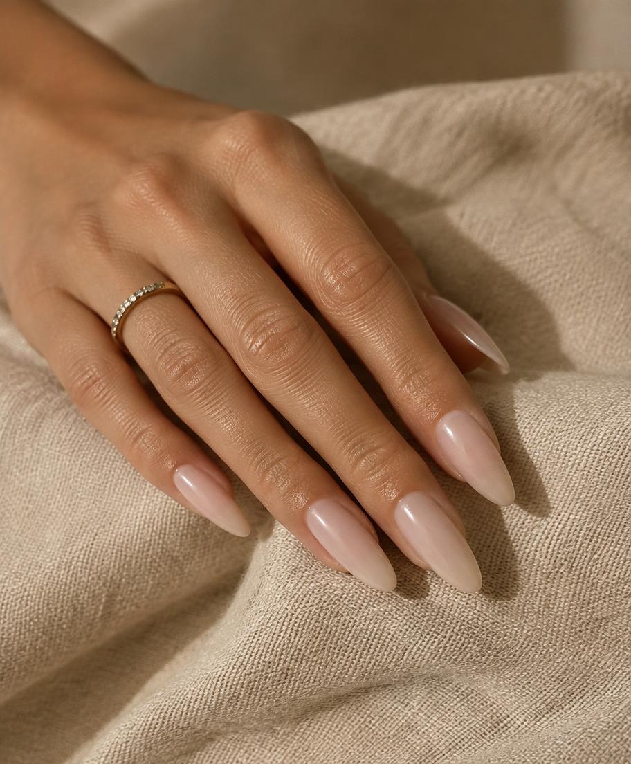 Milky nude nail extensions on linen